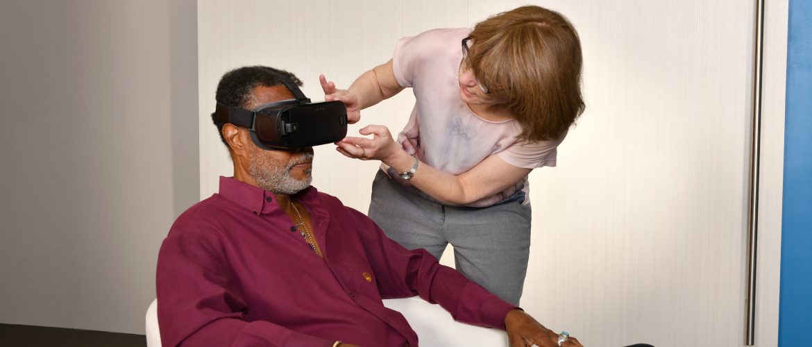 Project lead Lisa Sokoloff demonstrates Virtual Reality (VR) Dementia Simulation (Baycrest). Her innovation was selected for the Early Adoption Initiative.