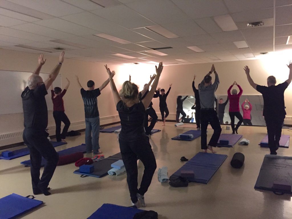 YouQuest participants doing group yoga