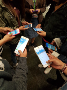Six people are pictured engaging with the SOS app. 