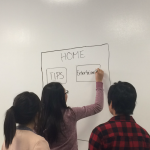 Students draw on the white board during a CABHI-hosted workshop to brainstorm innovations.