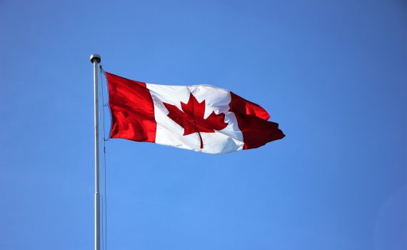 Canadian flag floating in the wind.